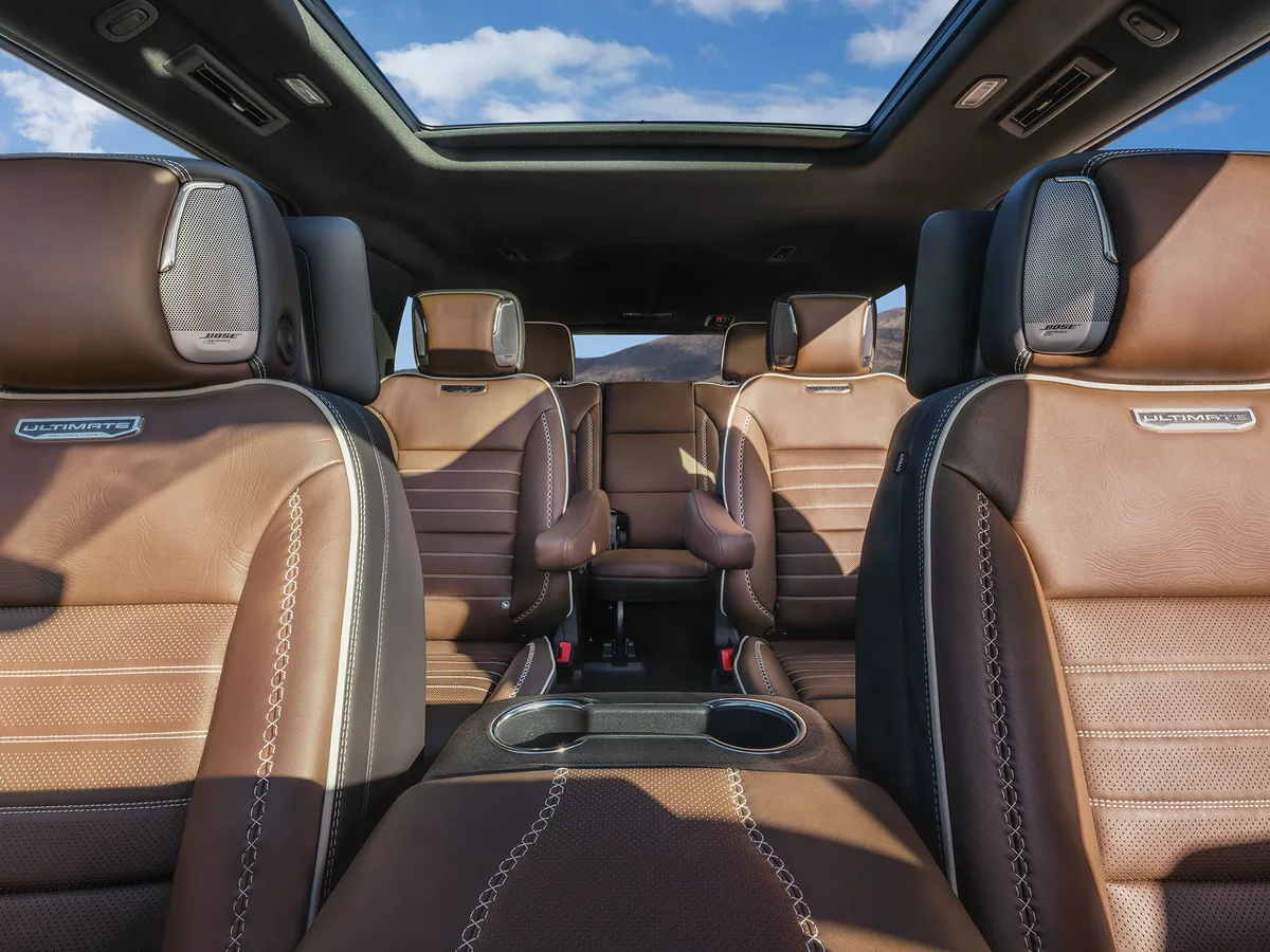 Close-Up of a GMC Yukon Denali Ultimate Brown Leather Seat Headrest with Integrated Bose Performance Series Speaker